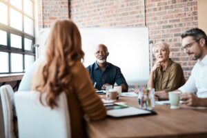 business meeting about fiduciary liability insurance