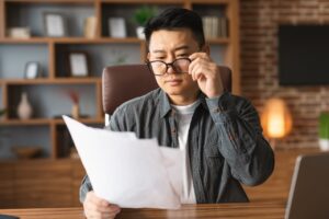 business owner looking over documents for business insurance rates