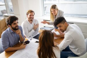 employees in a meeting discussing employment practices